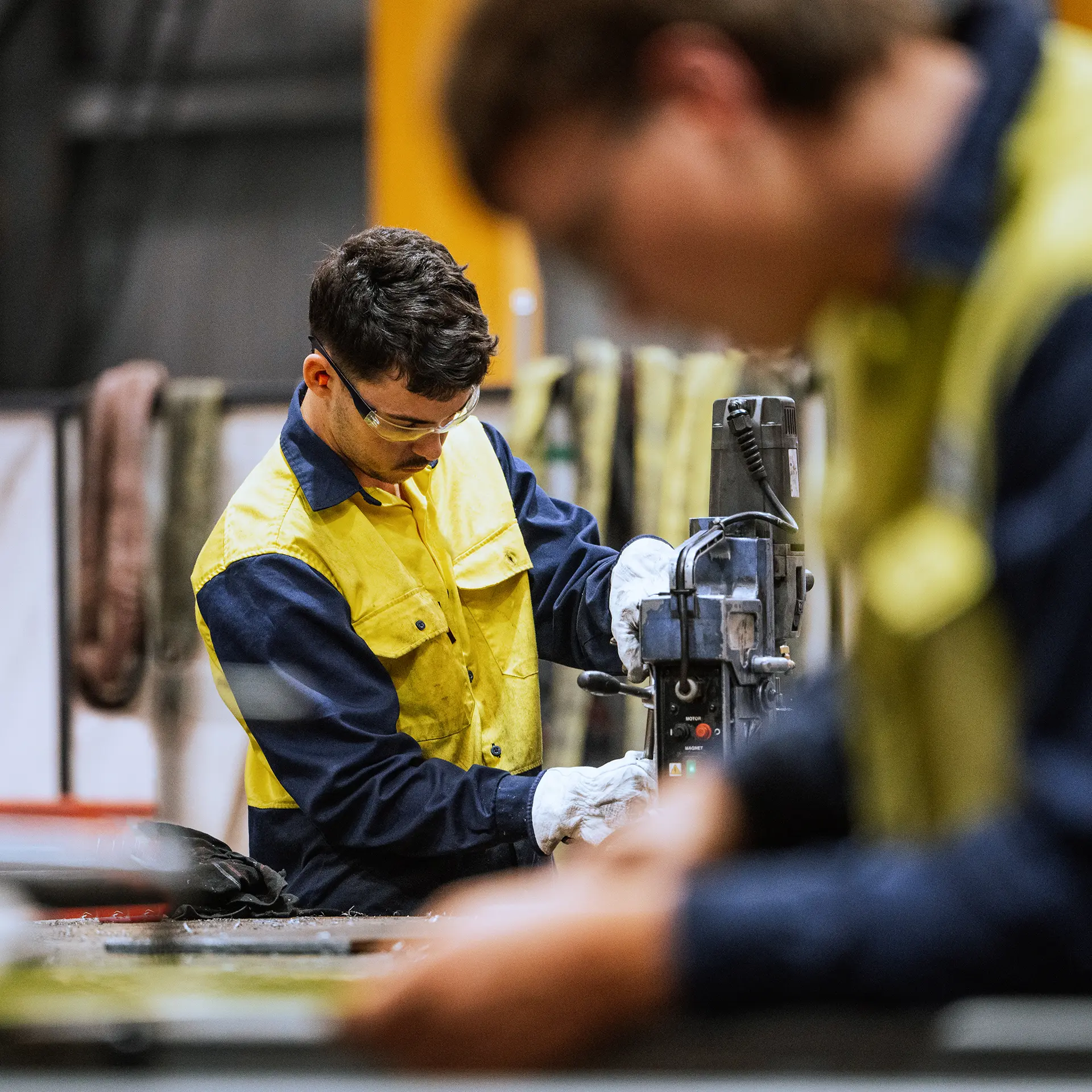 men working heavy machinery