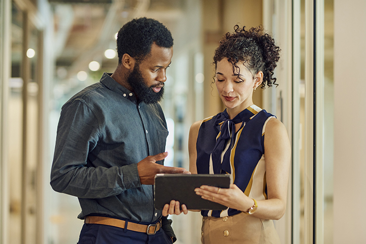 An engaged discussion about a project using a tablet